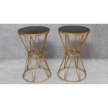A pair of contemporary gilt metal circular occasional tables with smoked glass tops. H.65cm