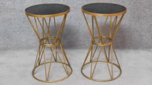A pair of contemporary gilt metal circular occasional tables with smoked glass tops. H.65cm
