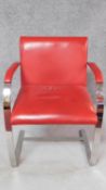 A red leather upholstered desk chair on heavy chrome cantilevered base. H.81cm