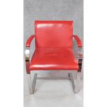 A red leather upholstered desk chair on heavy chrome cantilevered base. H.81cm