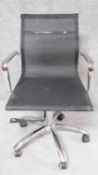 An Eames style desk chair with black mesh seat and back on chrome base. H.90cm