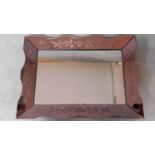 An Art Deco wall mirror in shaped etched peach glass frame. 74x53cm