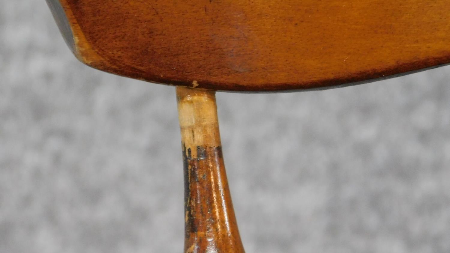 A Victorian walnut revolving piano stool with foliate carving to the back on reeded stretchered - Image 11 of 14