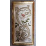 A framed Italian stumpwork embroidery from 1850 with ivory silk background with raised design of
