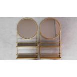 A pair of gilt metal framed wall shelves each fitted with circular mirrors H.90cm