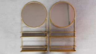 A pair of gilt metal framed wall shelves each fitted with circular mirrors H.90cm