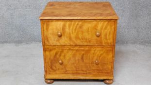 A mid 19th century satin birch commode. H.68 W.66 D.56cm