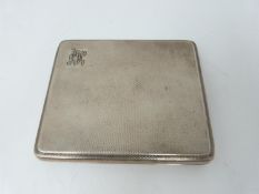 A silver cigarette case with engine turned decoration, London, 1948, gilded interior, Bravingtons