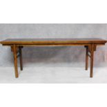 A large Chinese hardwood alter table with rectangular top on circular section supports. H.81 W.223