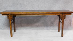 A large Chinese hardwood alter table with rectangular top on circular section supports. H.81 W.223