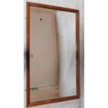 A large hall mirror in mahogany frame with bevelled plate. 174x99cm