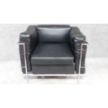 A black faux leather upholstered Le Corbusier style armchair with chrome tubular frame. H.72 W.90