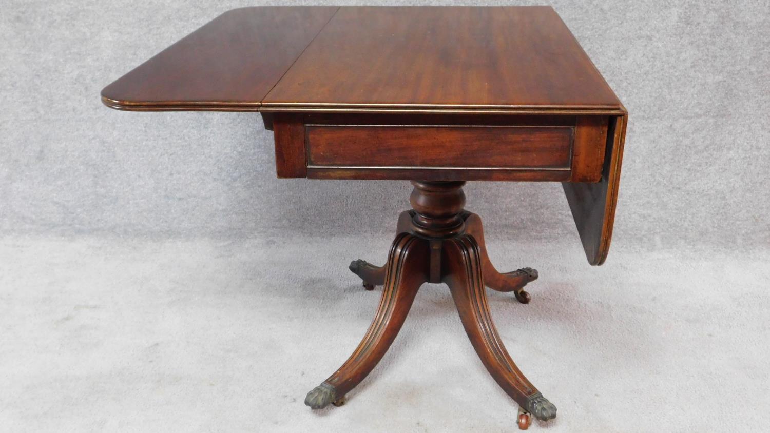 A Regency mahogany drop flap Pembroke table fitted end drawer on swept fluted quadruped supports. - Image 3 of 8