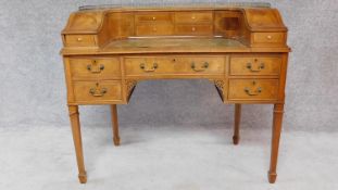 A Georgian style mahogany, crossbanded and satinwood line inlaid Carlton House desk with a galleried