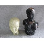 A vintage glass head and ceramic Art Deco African bust with gilded details. H 43cm.