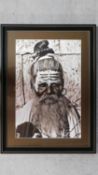 A large framed and glazed print, portrait of a tribal man. 90x67cm