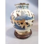 A middle eastern ceramic glazed vase on carved wooden Chinese stand. H23cm.