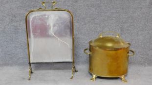 An Art Nouveau style brass fire screen together with a similar lidded coal bucket. H.66cm (screen)