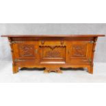 A mid 20th century Continental carved oak sideboard decorated with animal and scroll work