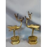 A pair of 19th century brass Chinese herons holding bamboo shoot candlesticks, with engraved