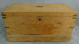 A 19th century brass bound pine travelling trunk with twin carrying handles and name plaque to the