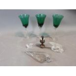 A collection of glass and ceramic items, including three turquoise glass twist stem glasses, a