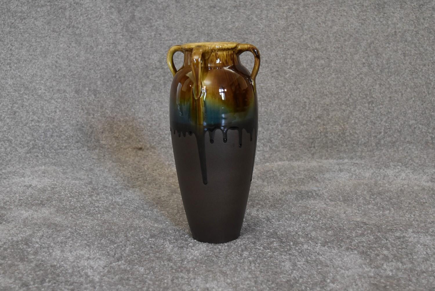 A Persian drip glazed vase with four handles. H.30cm