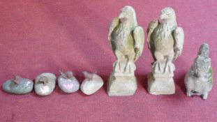 A miscellaneous collection of seven garden figures to include a pair of eagles and various cast iron