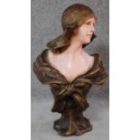 An Art Nouveau style moulded bust of a lady wearing period hat and dress. H.59cm