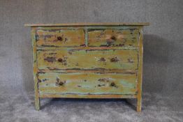 A mid 20th century mahogany chest of drawers in distressed painted finish. H.80 x 106cm
