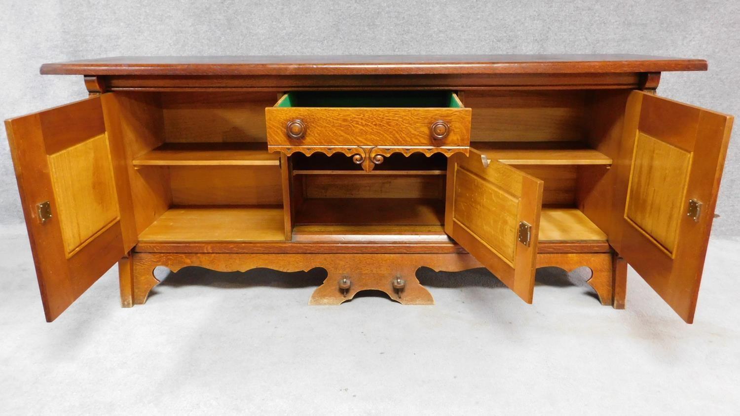 A mid 20th century Continental carved oak sideboard decorated with animal and scroll work - Image 3 of 11