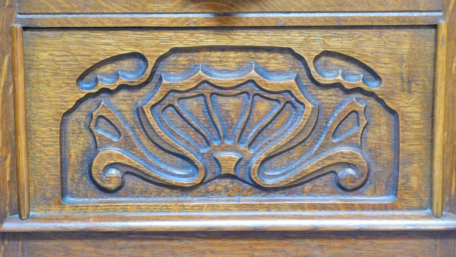 A mid 20th century Continental carved oak sideboard decorated with animal and scroll work - Image 8 of 11