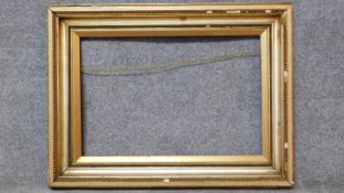 A 19th century gilt and gesso picture frame. 77x102cm