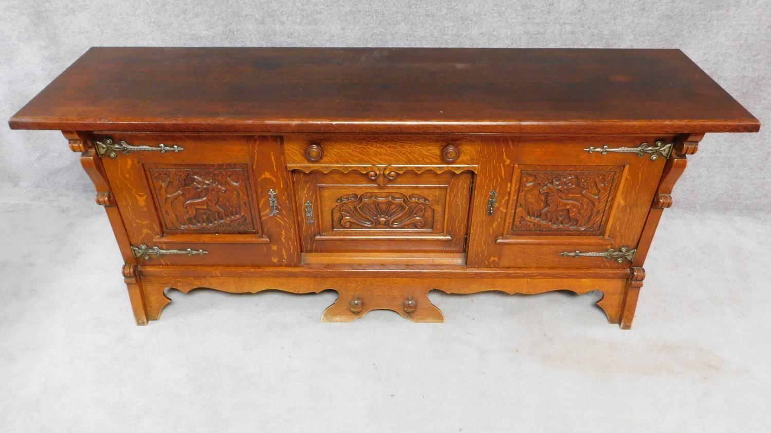 A mid 20th century Continental carved oak sideboard decorated with animal and scroll work - Image 2 of 11