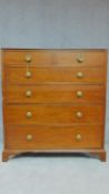 A Regency mahogany chest of two short over three long drawers fitted brass handles on bracket