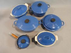 Collection of Vintage blue Le Creuset kitchenware. Three casseroles in varying sizes, a small lidded