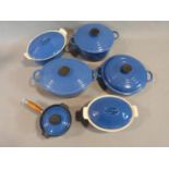 Collection of Vintage blue Le Creuset kitchenware. Three casseroles in varying sizes, a small lidded