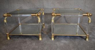 A pair of Empire style side tables with gilt metal frame and mirrored shelf to base and glass