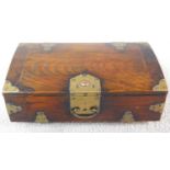 A Chinese wooden box with brass details with swing handle and Chinese script to the inside. 30x19x