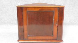 A small 19th century mahogany corner cabinet. H.53 W.61 D.30cm