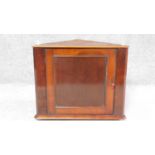 A small 19th century mahogany corner cabinet. H.53 W.61 D.30cm