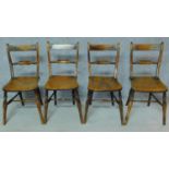 A set of four 19th century country bar back dining chairs with elm seats on turned stretchered