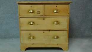 A 19th century pine chest of two short over two long drawers on bracket feet. H.83 W.87 D.48cm