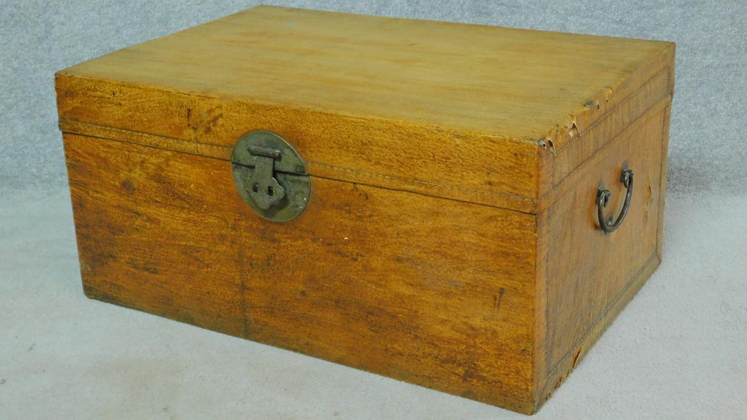 A Chinese lacquered travelling trunk with twin carrying handles. H.40 W.81 D.55cm - Image 2 of 7