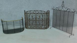 A miscellaneous collection of three fire guards to include a 19th century brass and iron example.