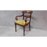 A Regency mahogany armchair with bar back and drop in seat on turned tapering supports. H.90cm