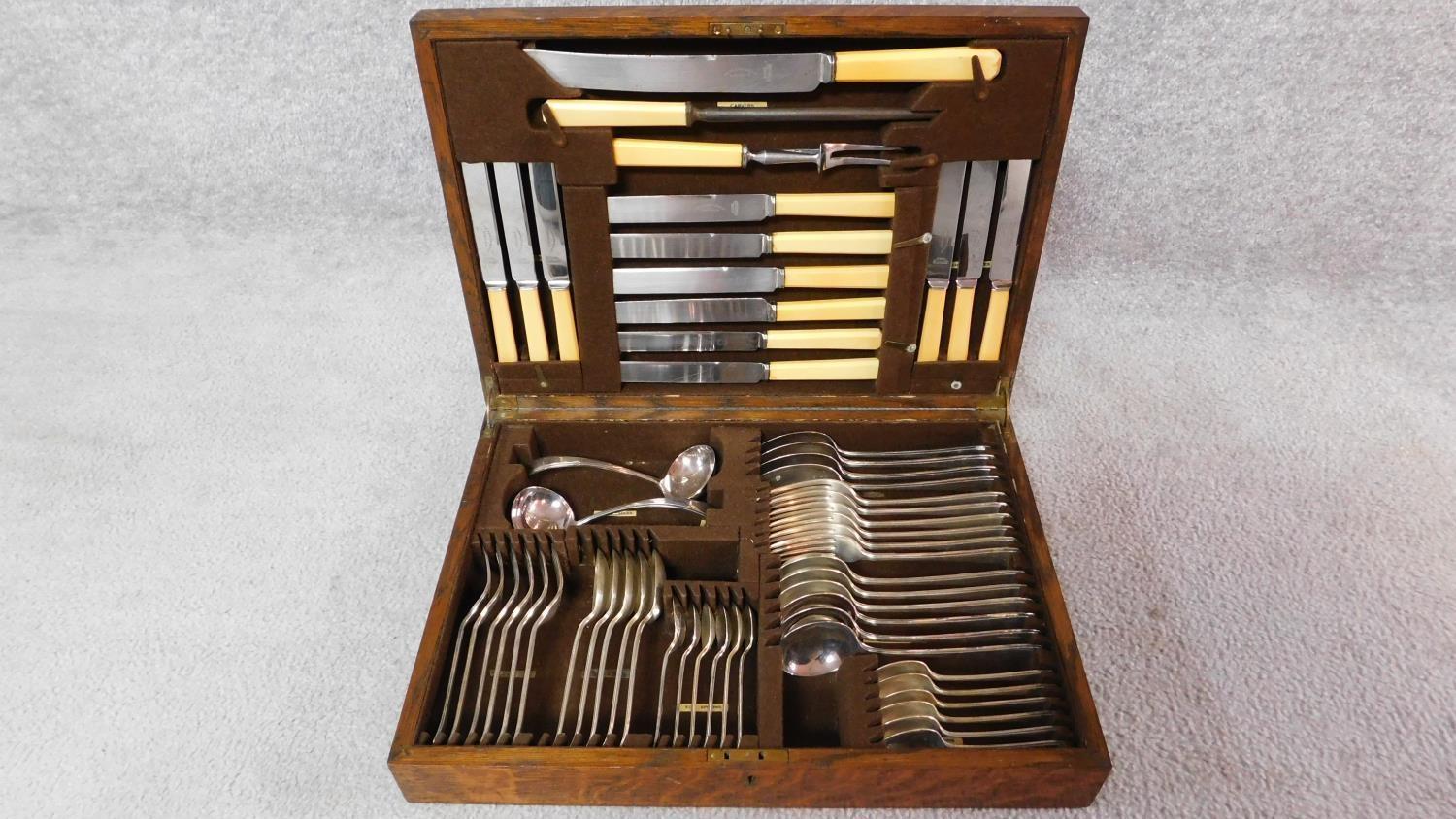 A complete cased set of silver plated cutlery by A. E. Poston & Co, Lonsdale, Sheffield. In oak case