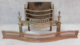 An antique brass and steel Adam style fire grate and a 19th century pierced steel fender. H.55 (