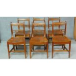 A set of six 19th century mahogany dining chairs with solid seats and squab cushions on square