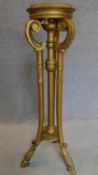 A 19th century carved giltwood torchere stand. H.103cm